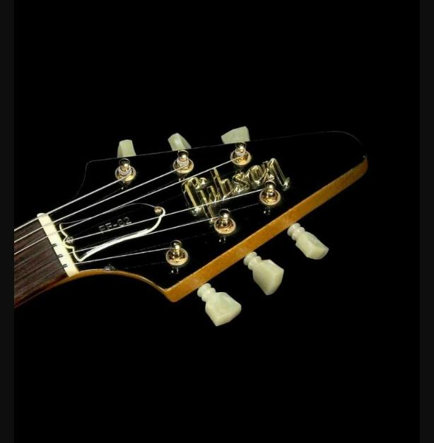 Flying V Headstock Guitar 3D Raised Logo Metallic Real Gold NO USA CUSTOMS FEES.